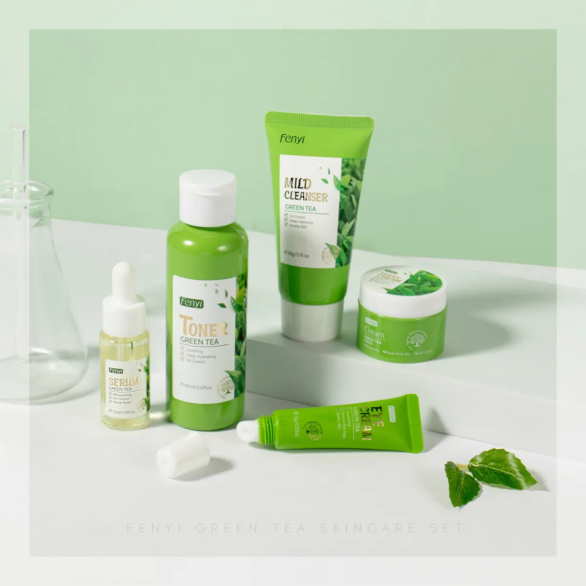 Fenyi Green Tea skincare products on a white surface with a light green background